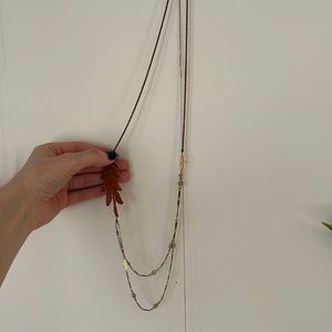 Long necklace with antique lace detail
